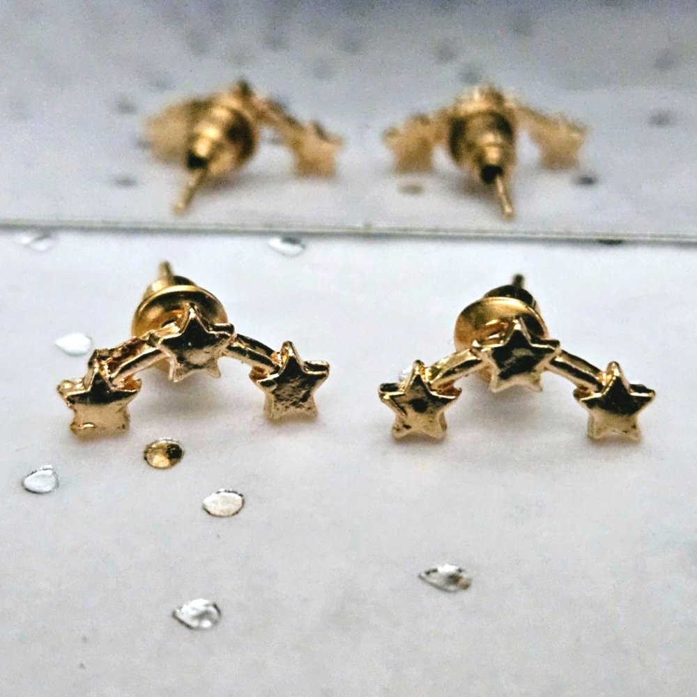 Gold star climber earrings